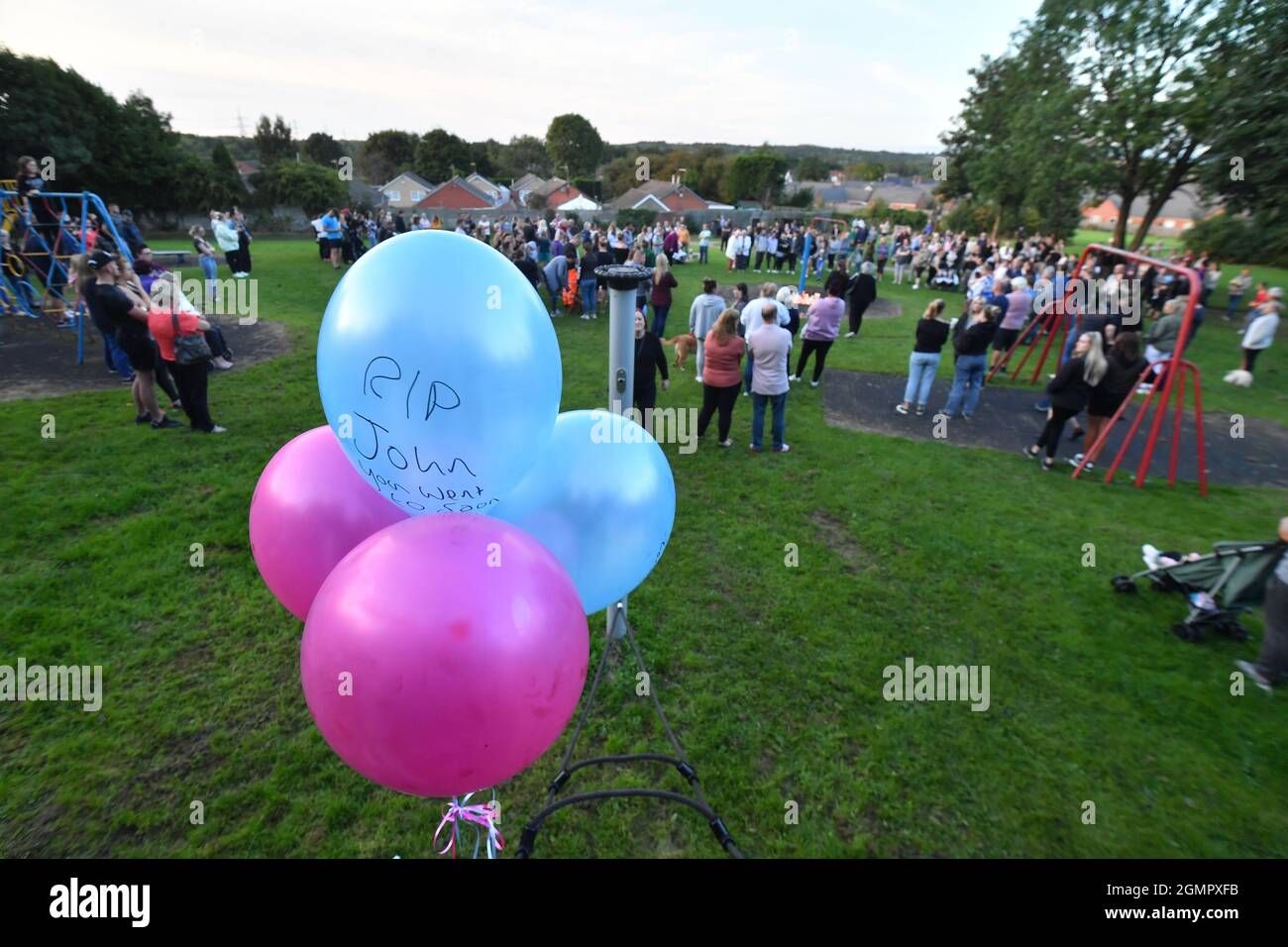 Members of the public attend a vigil at the scene in Chandos Crescent, Killamarsh, near Sheffield, where four people were found dead at a house on Sunday. Picture date: Monday September 20, 2021. Stock Photo