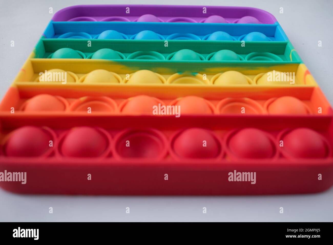 Close up of points of a colorfull kids toy on a white table Stock Photo