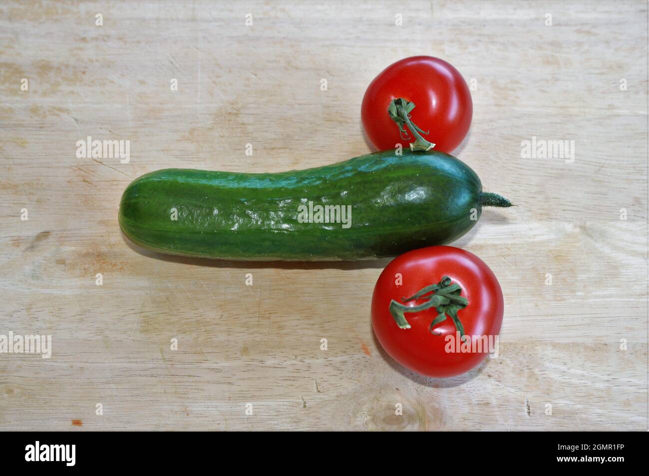 Vegetables in the form of cucumbers and tomatoes  symbolize Stock Photo