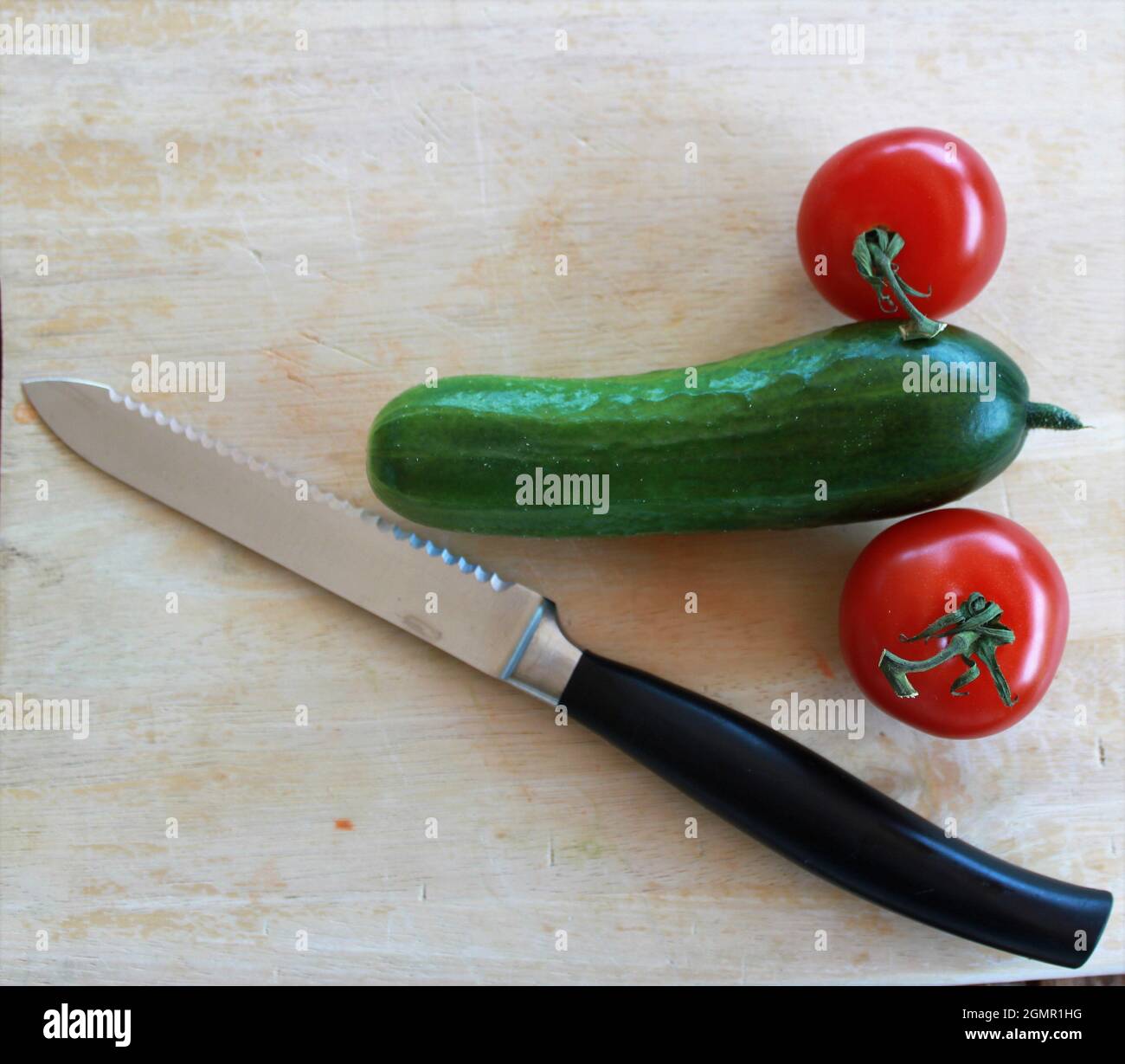 Vegetables in the form of cucumbers and tomatoes symbolize Stock Photo