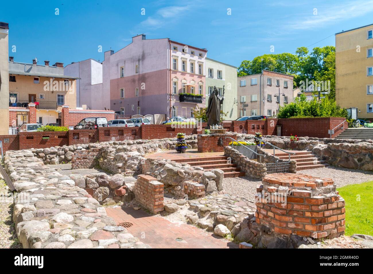 Bytow, Poland - May 31, 2021: Square with John Paul II sculpture and remains of the former church of St. Catherine's are in Pottery Square. Stock Photo