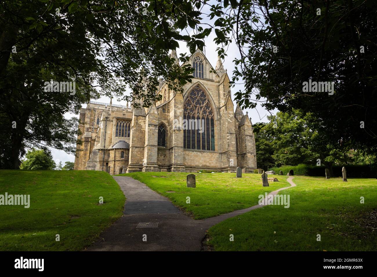 Back View of Ripon Cathedral looking through trees Stock Photo