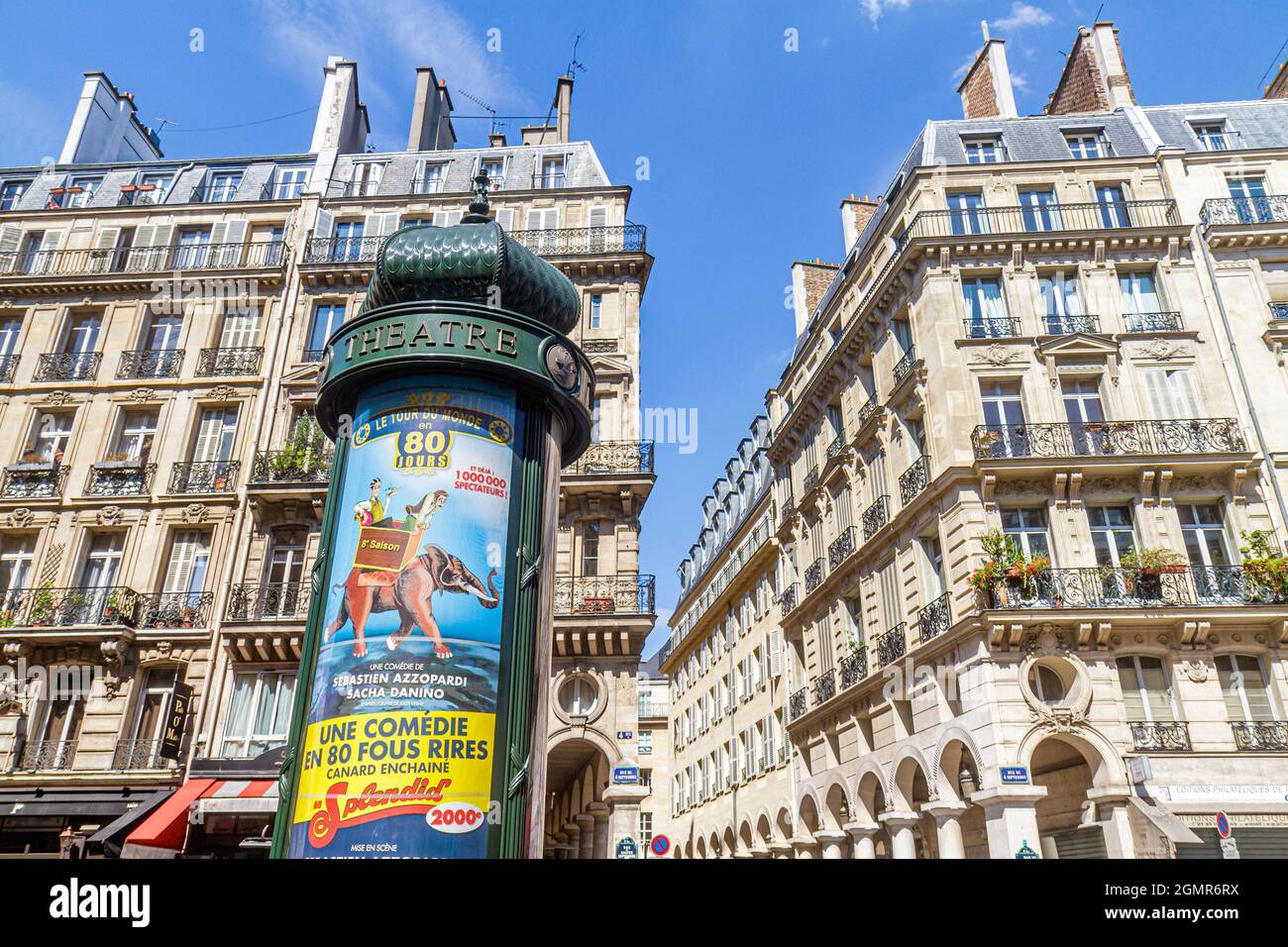 Paris France,2nd arrondissement,Rue du 4 Septembre,billboard Morris column advertising,Haussmann apartment buildings Stock Photo