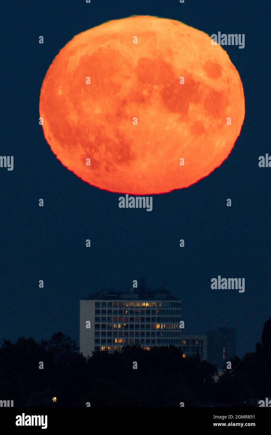 The full moon, also known as the harvest moon, rises above Birmingham ...