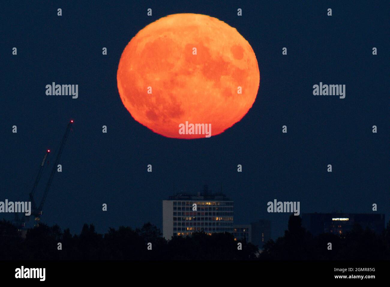 The full moon, also known as the harvest moon, rises above Birmingham ...
