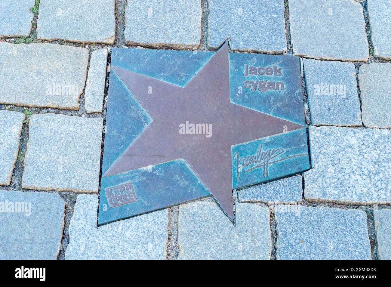 Opole, Poland - June 4, 2021: Star of Jacek Cygan at Walk of Fame in Opole known as Aleja Gwiazd Festiwalu Polskiej Piosenki. Jacek Antoni Cygan is a Stock Photo