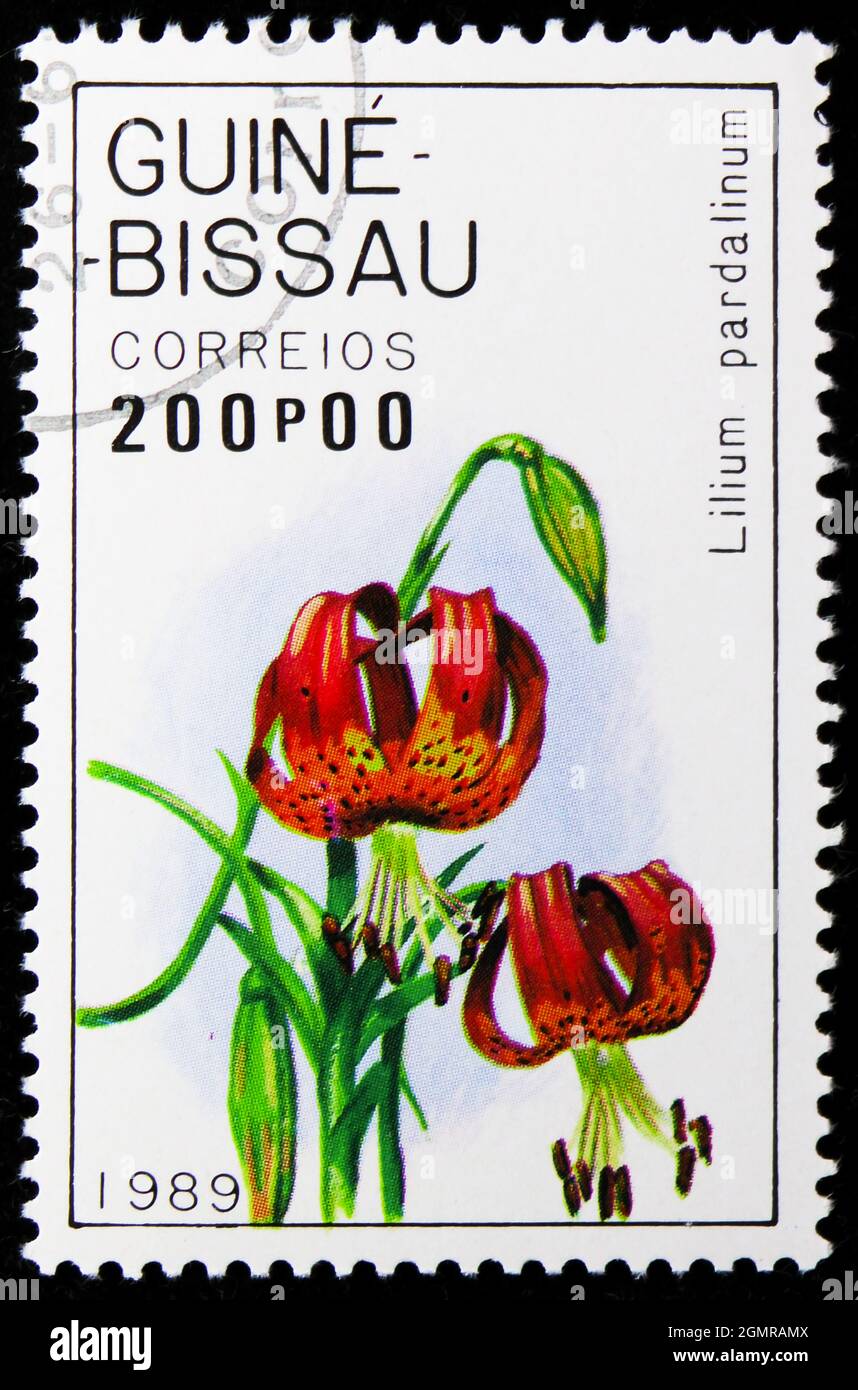 MOSCOW, RUSSIA - NOVEMBER 26, 2018: A stamp printed in Guinea-Bissau shows Pardalinum, Lilies serie, circa 1989 Stock Photo