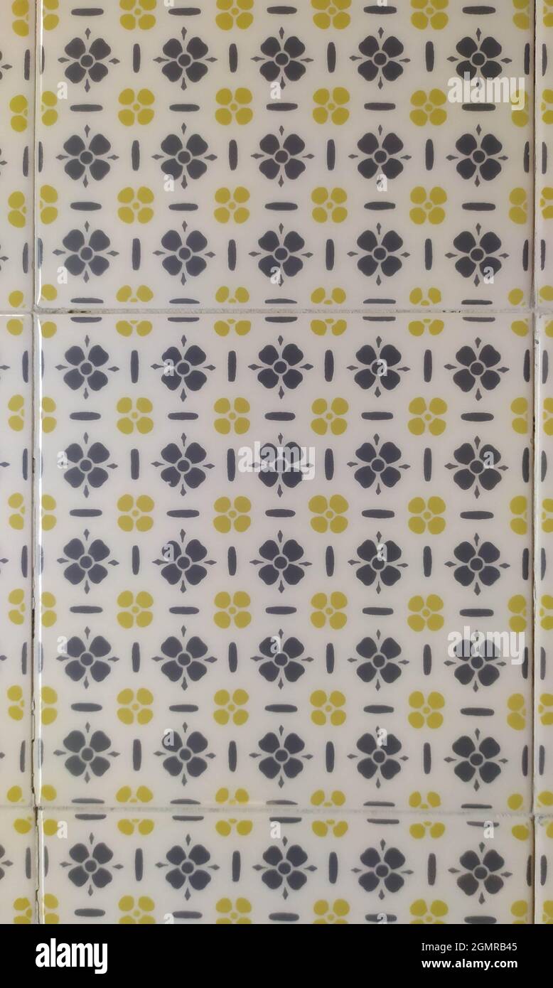 Square Ceramic Tile with Gray and Yellow Floral Patterns Stock Photo
