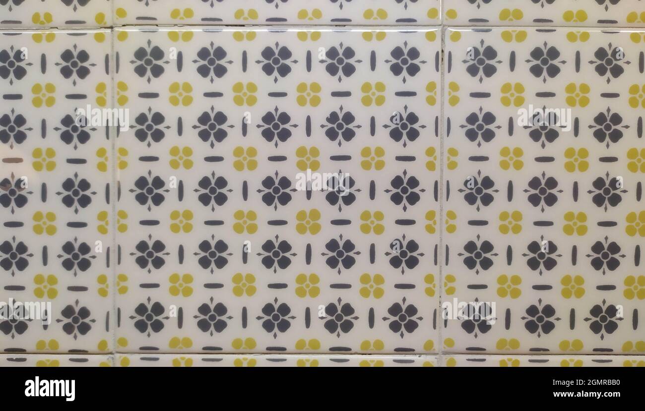 Square Ceramic Tile with Gray and Yellow Floral Patterns Stock Photo