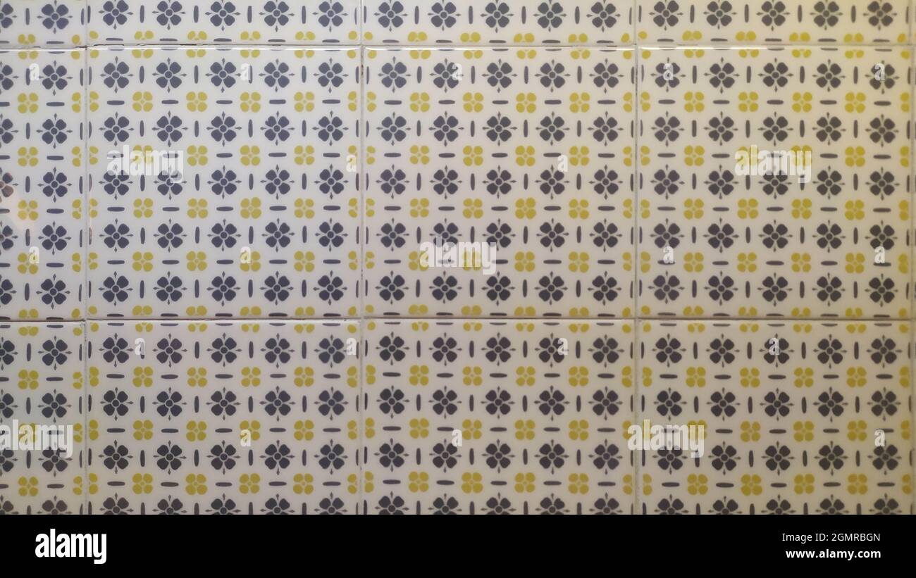 Square Ceramic Tile with Gray and Yellow Floral Patterns Stock Photo