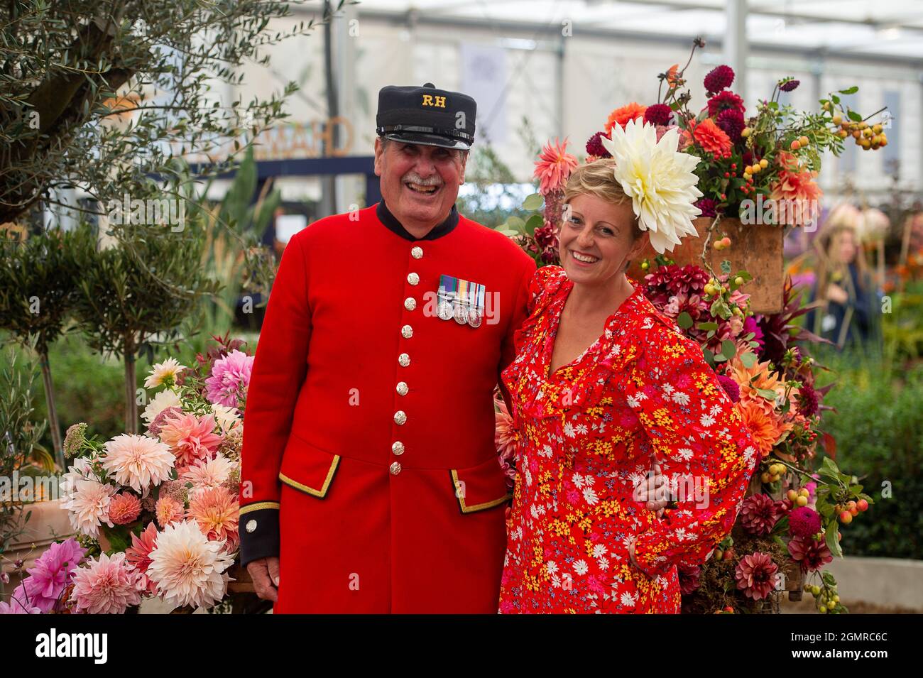 London, UK. 20th September, 2021. Chelsea Pensioner Arthur Currie with Andie McDowell. It was busy day at the Press Day for the first Autumnal RHS Chelsea Flower Show. The show was cancelled last year following the Covid-19 Pandemic. Credit: Maureen McLean/Alamy Live News Stock Photo