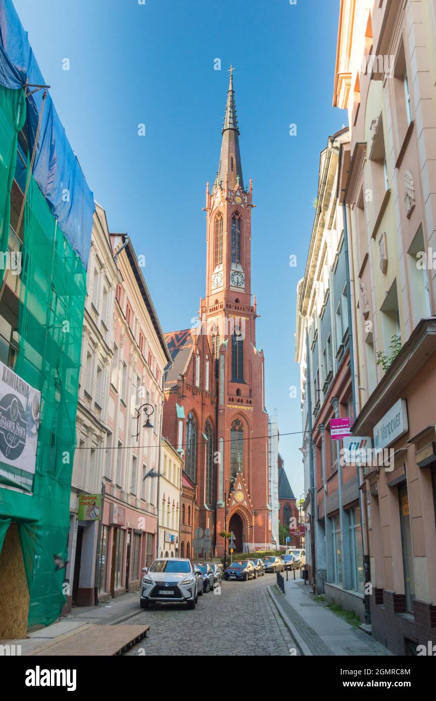 Walbrzych, Poland - June 3, 2021: Street view with tower of Holy Guardian Angels church in Walbrzych. Stock Photo