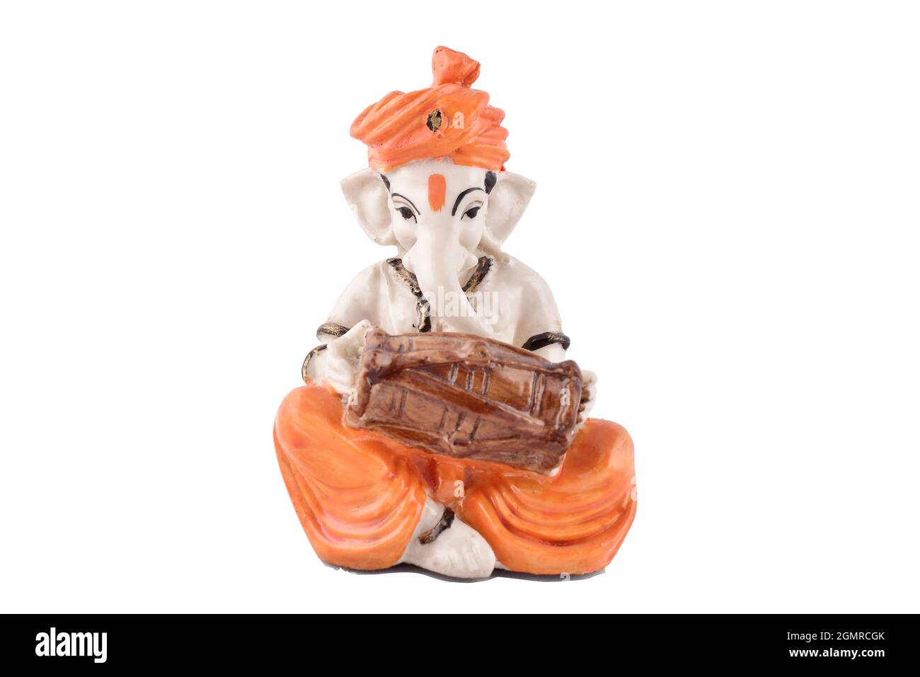 Indian god Ganesh playing dholak isolated on white background with clipping path, lord Ganesh Stock Photo