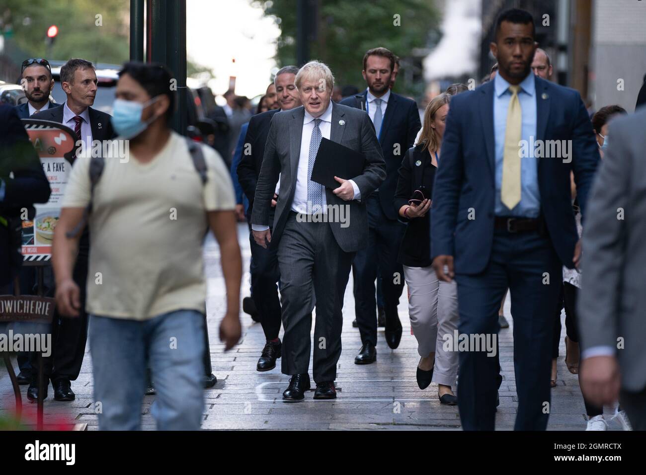 Prime Minister Boris Johnson walks to a television interview in New