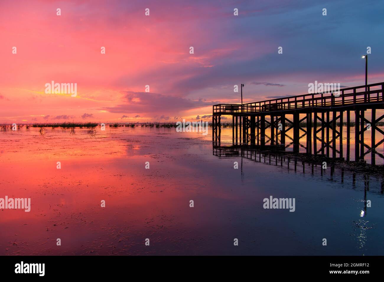 Mobile Bay pier at sunset Stock Photo
