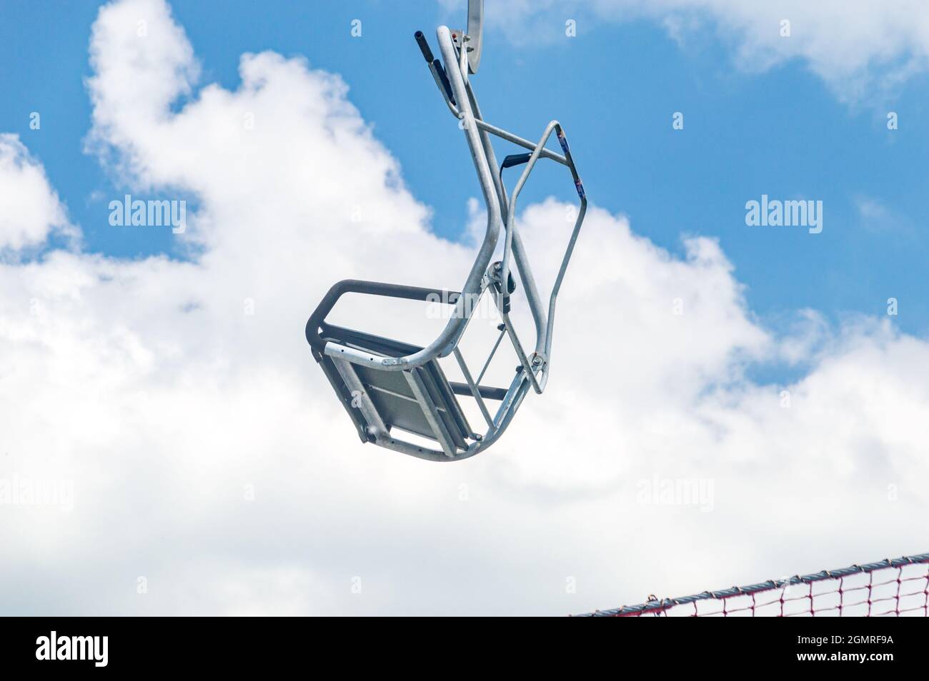Chair ski lift on cloudy background Stock Photo - Alamy
