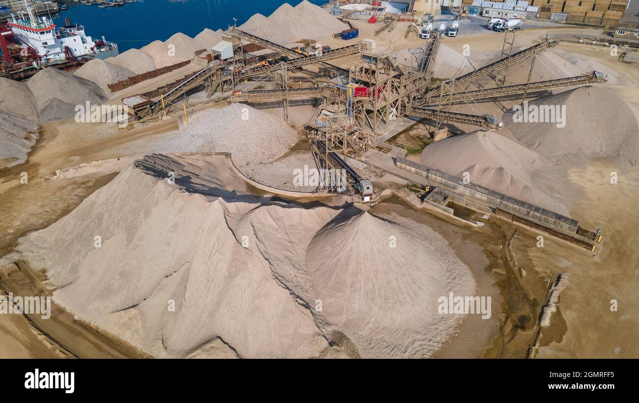Aerial view of sand and grawel sorting pit by industrial estate, Hove, East Sussex, UK. Stock Photo
