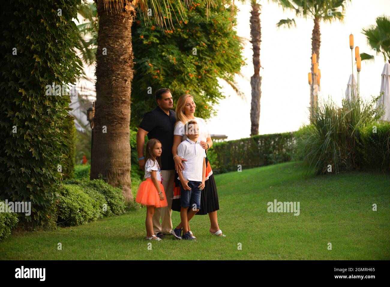 A happy family with kids in the park Stock Photo - Alamy