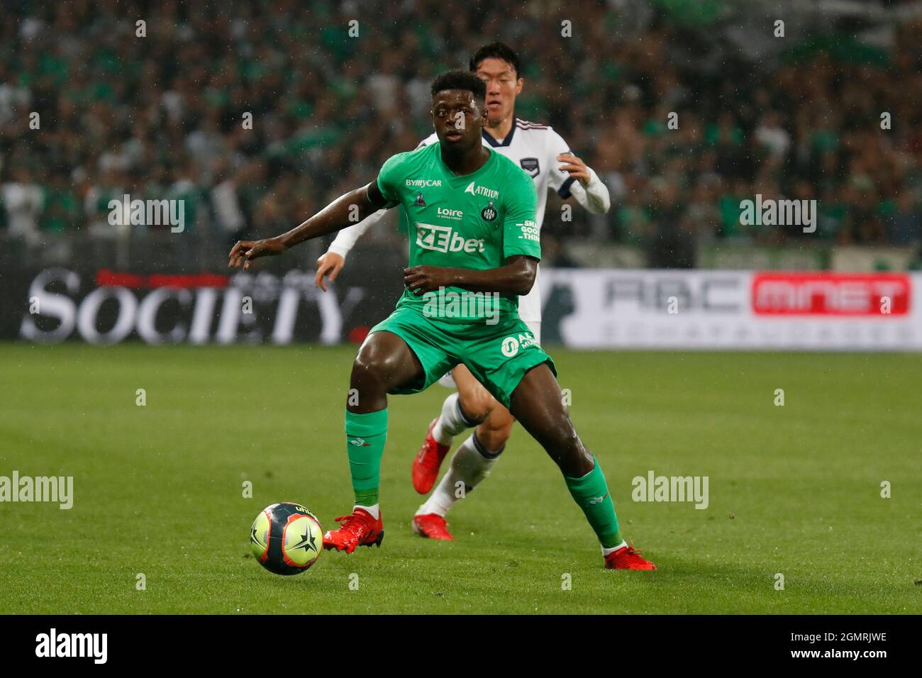 Saidou SOW of Saint Etienne and Ui Jo HWANG of Bordeaux during the French  championship Ligue 1 football match between AS Saint-Etienne and FC  Girondins de Bordeaux on September 18, 2021 at