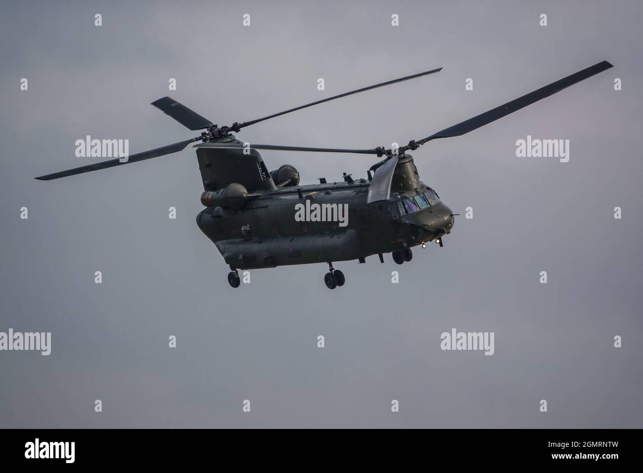 RAF Chinook tandemrotor CH47 helicopter flying fast and low in a