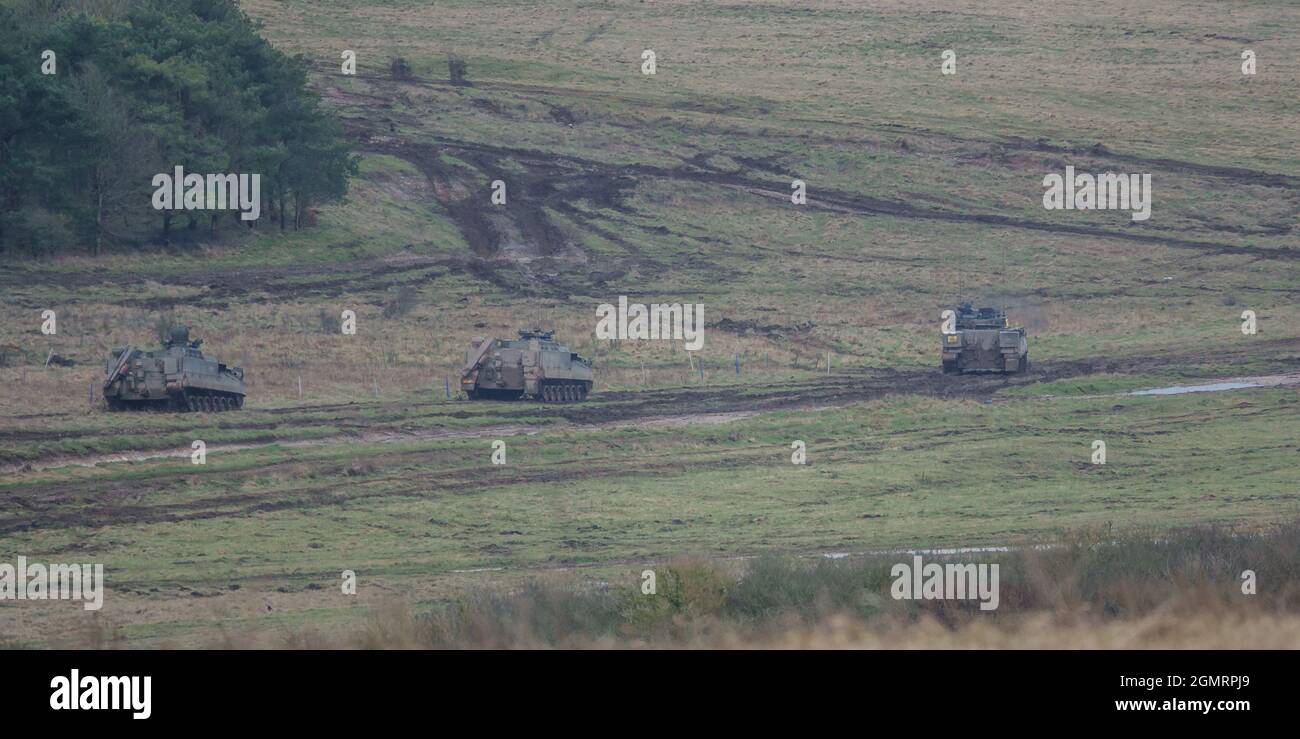 British army Warrior FV512 MRV & Warrior FV510 IFV tanks in action on a military exercise, Salisbury Plain, Wilts UK Stock Photo