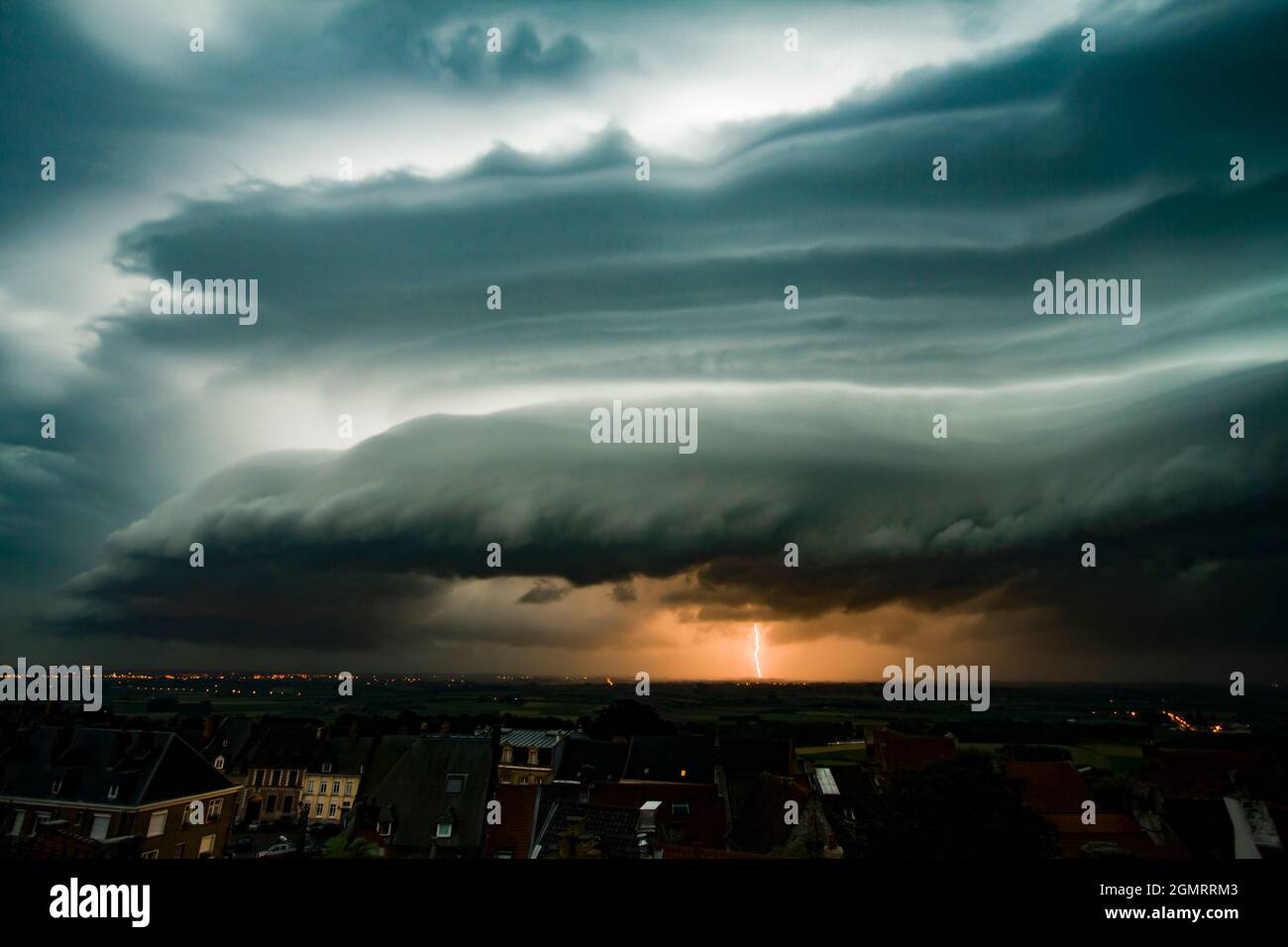 Lightning strike with shelf cloud Stock Photo