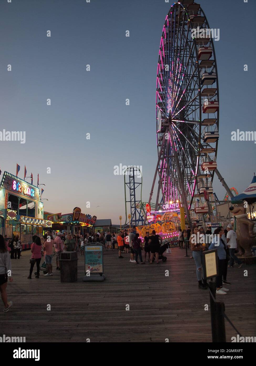 Seaside Heights, New Jersey during summer evening along the well known boardwalk. Rebuilt after Superstorm Sandy in 2012. Stock Photo