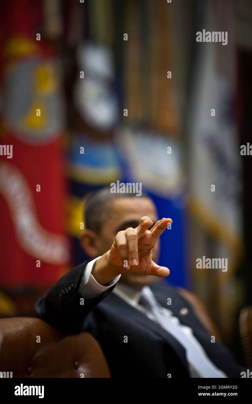 President Barack Obama gestures during a fiscal policy meeting in the Roosevelt Room of the White House, April 4, 2011. (Office White House Photo by Pete Souza) This official White House photograph is being made available only for publication by news organizations and/or for personal use printing by the subject(s) of the photograph. The photograph may not be manipulated in any way and may not be used in commercial or political materials, advertisements, emails, products, promotions that in any way suggests approval or endorsement of the President, the First Family, or the White House. Stock Photo
