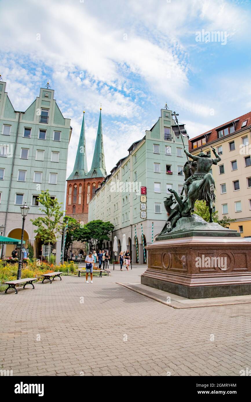 People walking around Nikolaikirchplatz, which is the wonderful and beautiful square that surrounds the magnificent St Nicholas Church which is one of Stock Photo
