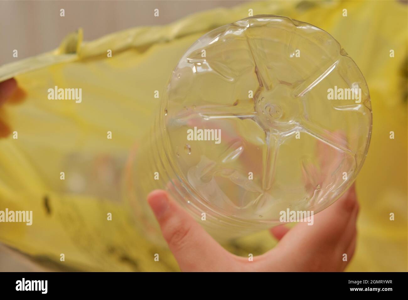 Eco plastic.Plastic bottles in a yellow bag. Collecting bottles for