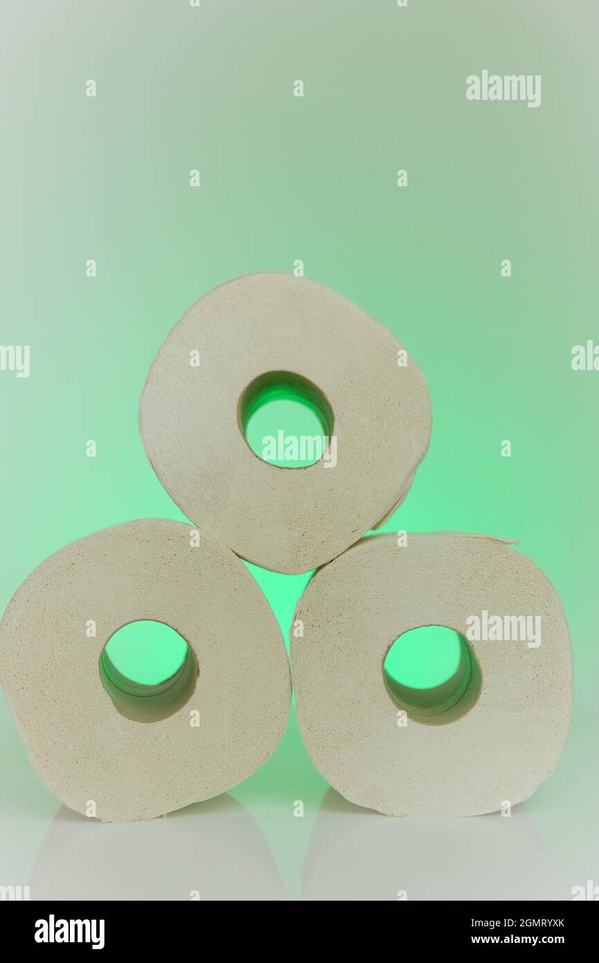 Toilet paper rolls .Organic clean bio toilet paper rolls set on light green background.Hygiene and cleanliness concept Stock Photo