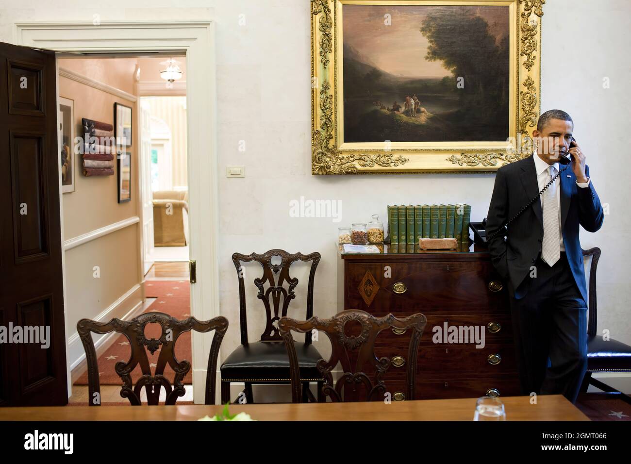 President Barack Obama talks with Mississippi Governor Haley Barbour about  severe storms and tornados that moved across the southeast, during a phone  call in the Oval Office Private Dining Room, April 28,