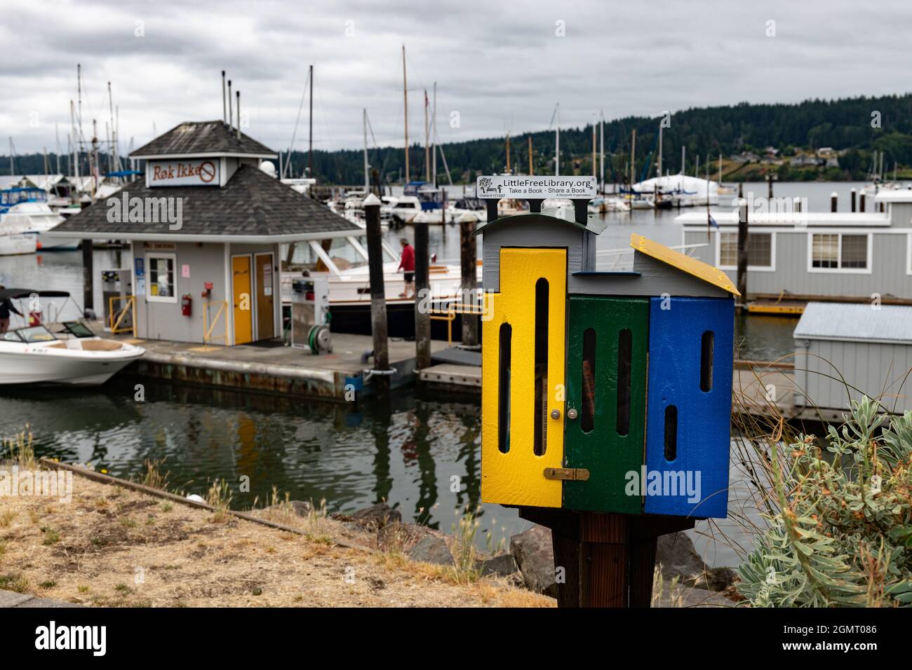 Colorful Free Lending Library Next to a Marina Stock Photo