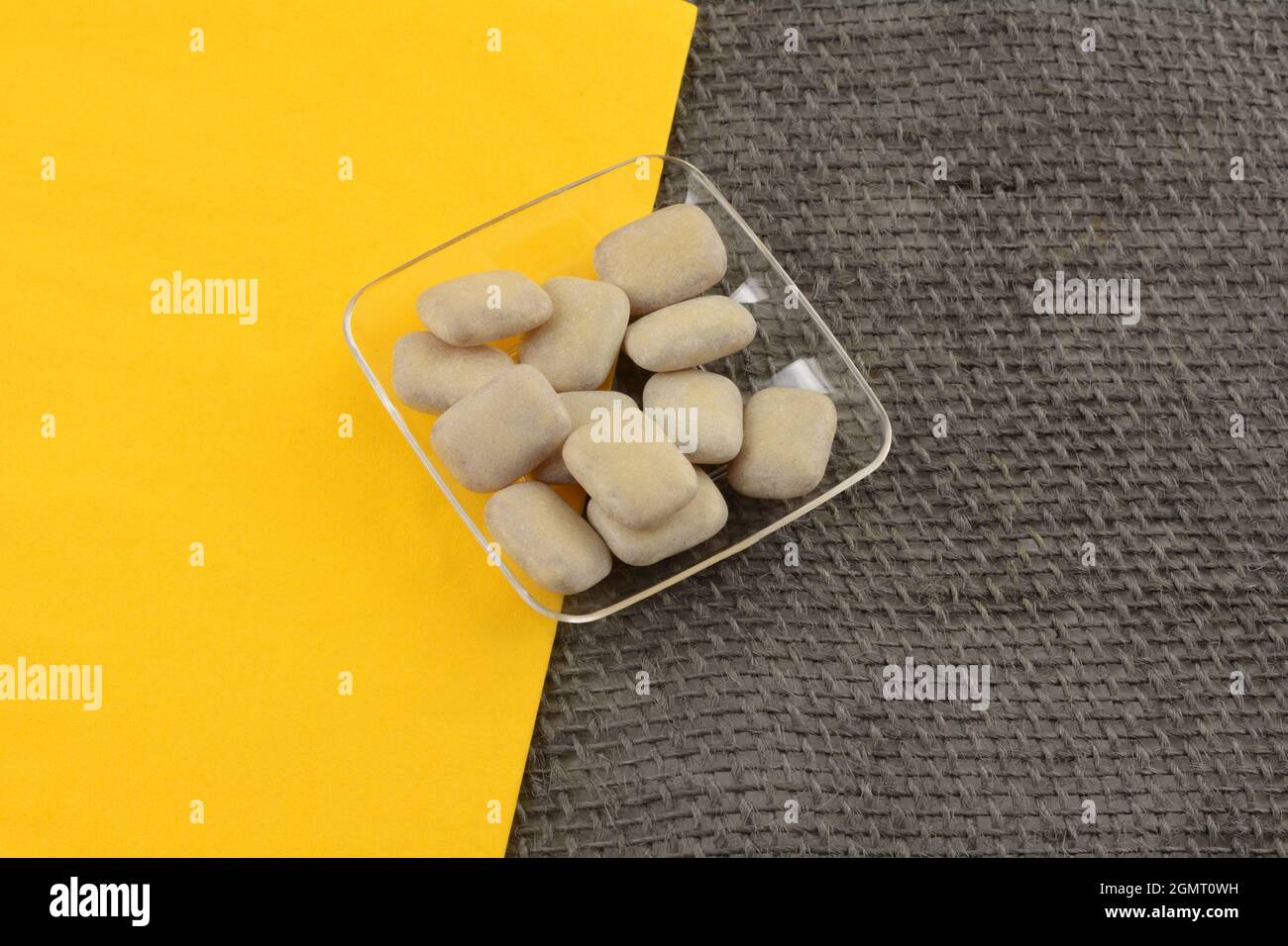 Gummy cola candies with hard shell and cola flavored center in candy