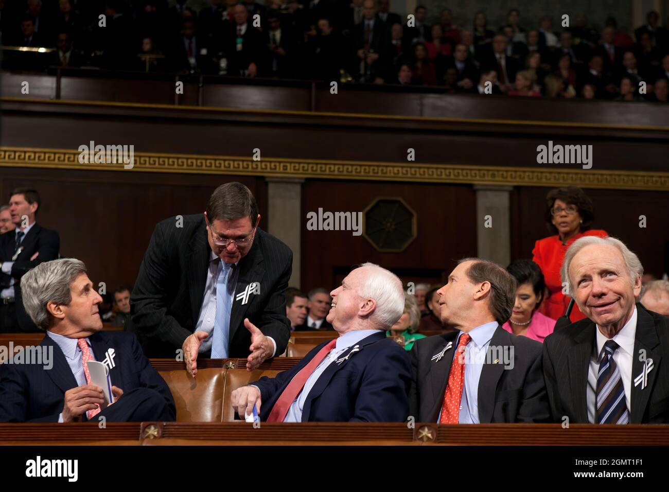 From left: Sen. John Kerry, D-Mass.; Rep. Michael Burgess, R-Texas.; Sen. John McCain, R-Ariz.; Sen. Tom Udall, D-N.M.; and Sen. Joe Lieberman, I-Conn., talk in the House Chamber before the start of President Barack Obama's State of the Union address at the U.S. Capitol, in Washington, D.C., Jan. 25, 2010. (Official White House Photo by David Lienemann) This official White House photograph is being made available only for publication by news organizations and/or for personal use printing by the subject(s) of the photograph. The photograph may not be manipulated in any way and may not be used i Stock Photo