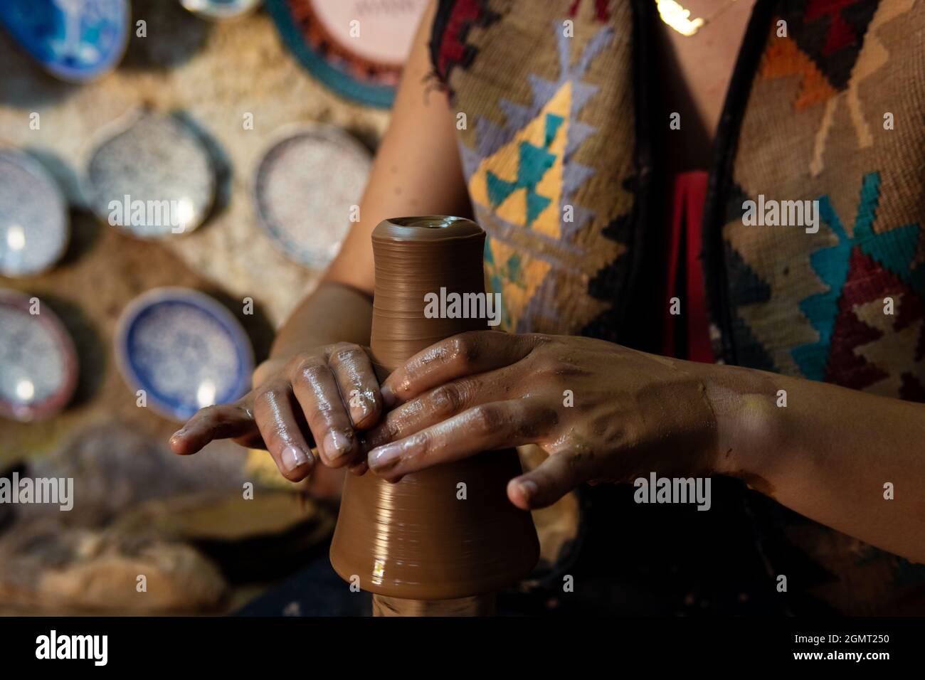 Pottery making, young woman learning to make pottery, a woman trying to