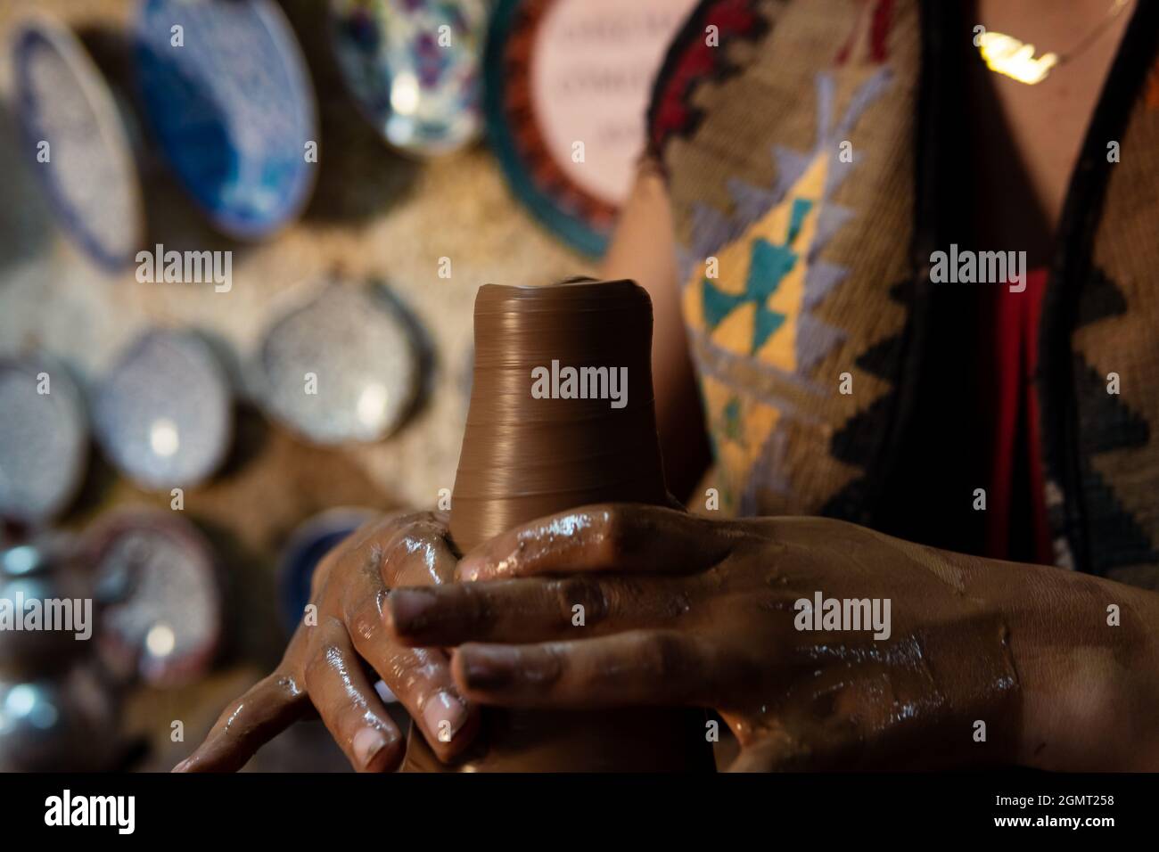 Pottery making, young woman learning to make pottery, a woman trying to