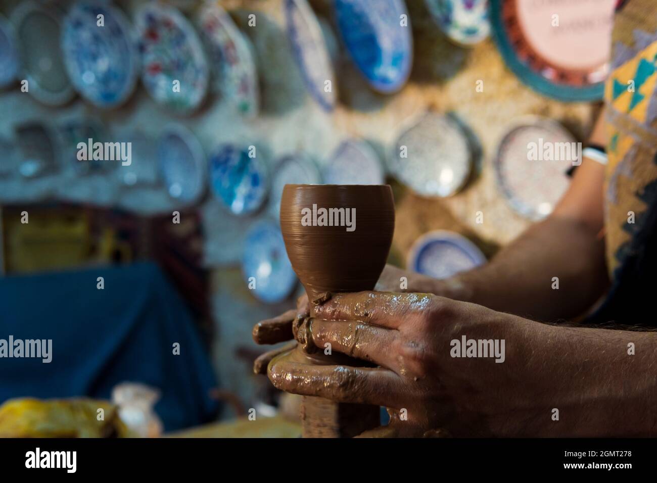 Pottery making, young man learning to make pottery , a man trying to