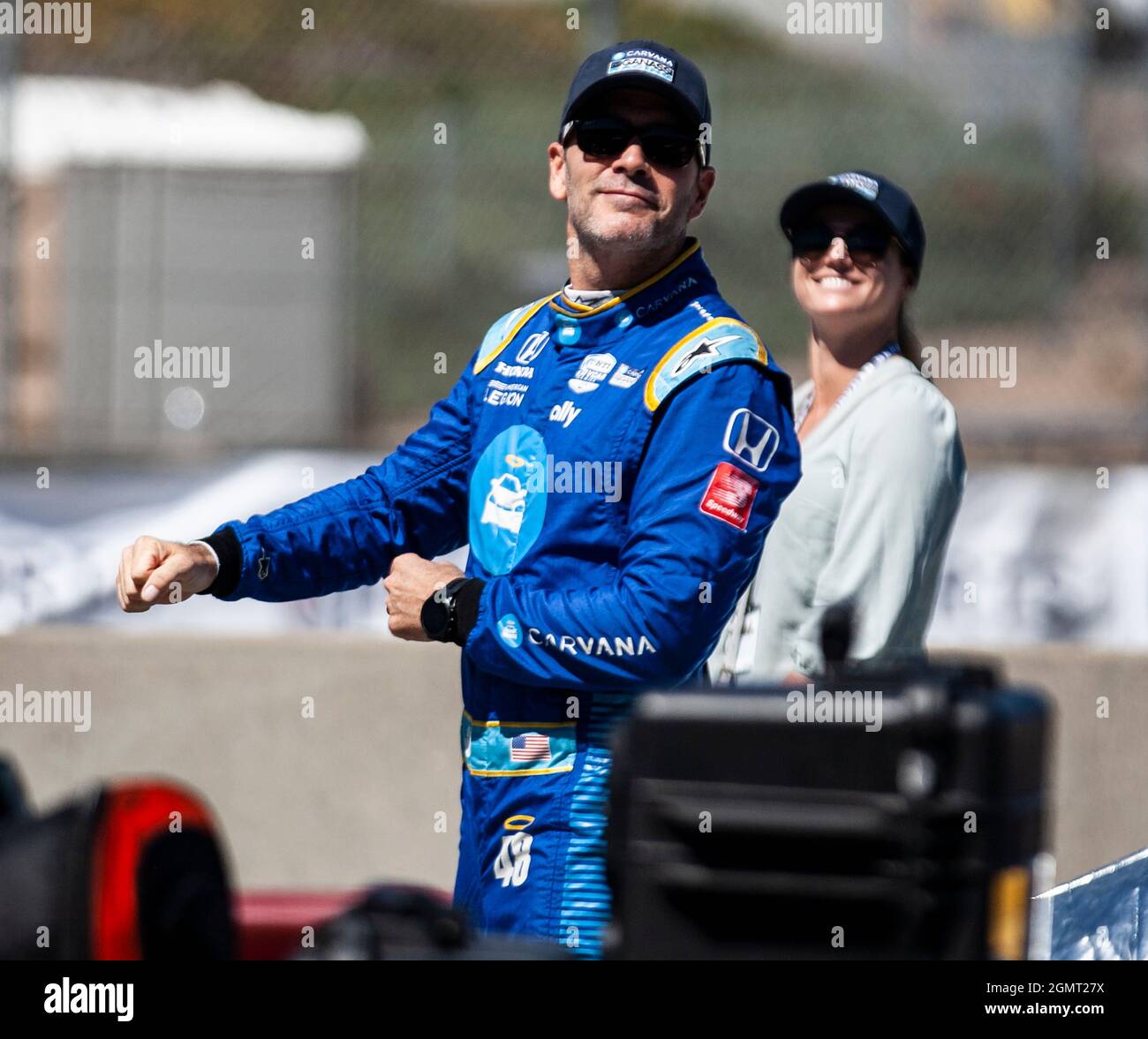 CAPTION CORRECTION: September 19 2021 Monterey CA, U.S.A. Chip Ganassi Racing driver Jimmie Johnson and wife on the grid before the NTT Firestone Grand Prix of Monterey Race at Weathertech Raceway Laguna Seca Monterey, CA Thurman James/CSM Stock Photo
