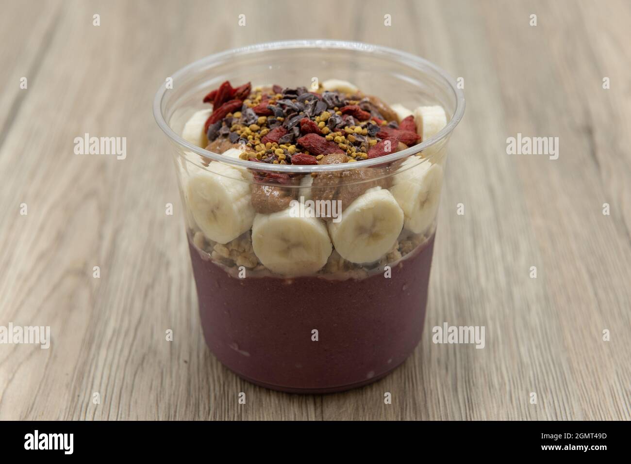 Acai fruit bowl cacao, goji berry, and bee pollen with blended flavors to increase your immunity and better nutrition. Stock Photo