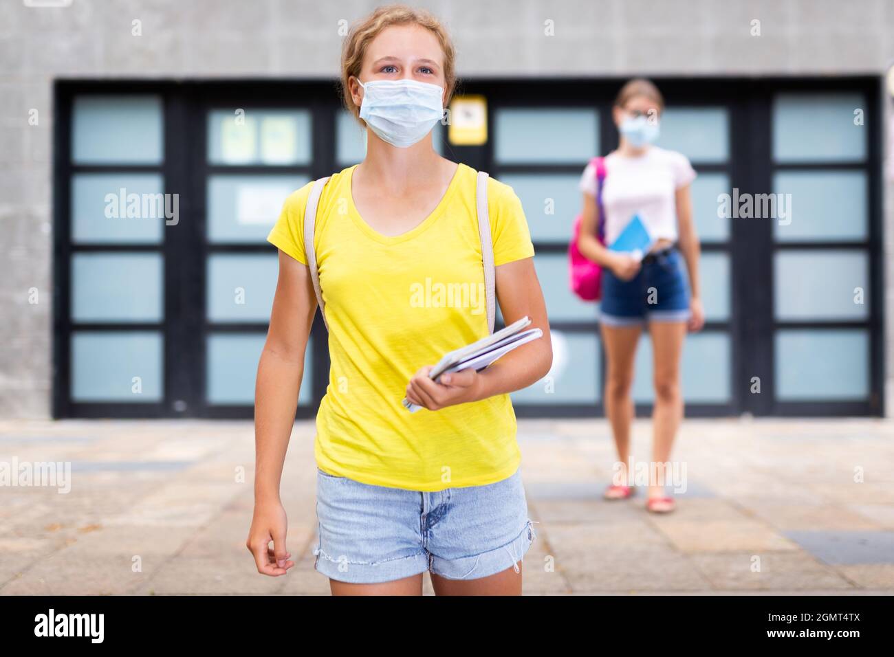 Youth teenager girls in face masks going from school Stock Photo Alamy