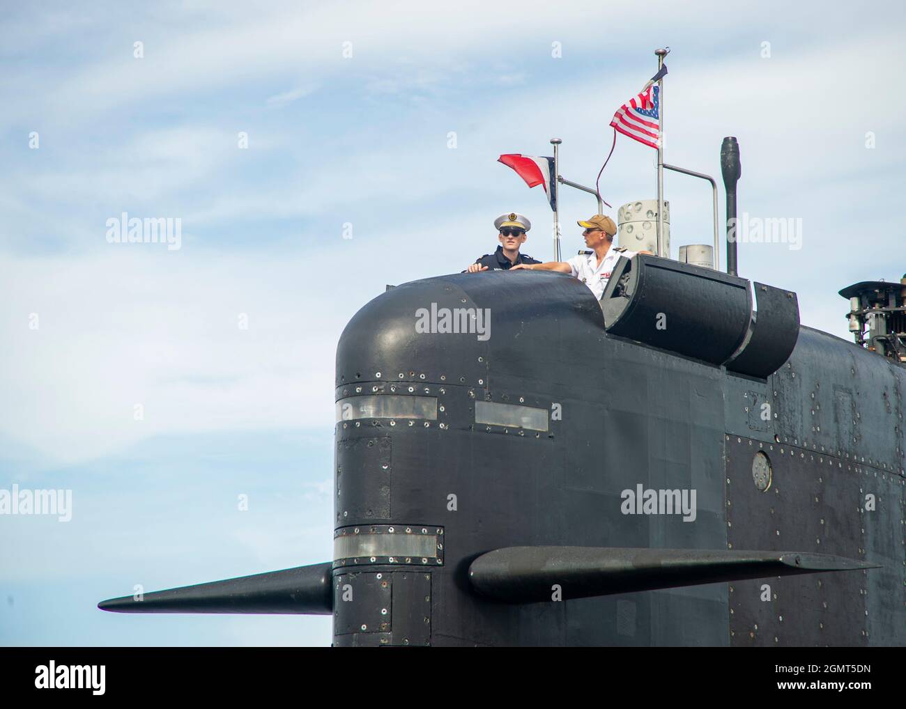 210916-N-UB406-0039  Leadership aboard the French submarine FNS Améthyste (S605) man the boat’s conning tower as it moors pier side at Naval Station Norfolk, Sept. 16, 2021. During the visit, Améthyste will be hosted by the U.S. Navy Virginia-class fast-attack submarine USS John Warner (SSN 785) as the two nations remember the Battle of the Capes, the decisive French victory over the British Fleet during the American Revolutionary War. (U.S. Navy Photo by Mass Communication Specialist 1st Class Cameron Stoner) Stock Photo