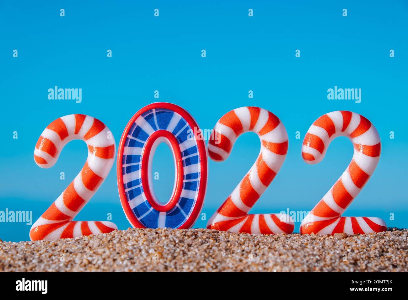 Christmas In The Sky 2022 Creative New Year And Christmas Card.new Year's Bright Numbers 2022 In  Stripes,On The Beach By The Sea,Against The Background Of The Blue Sky.closeup  Stock Photo - Alamy