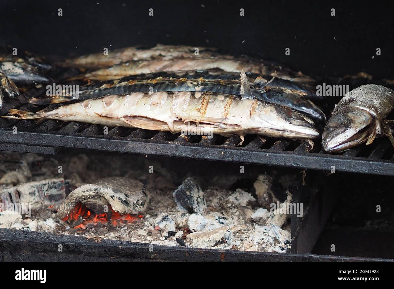 Cooking food on coals in the oven. Baked fish on coals Stock Photo Alamy