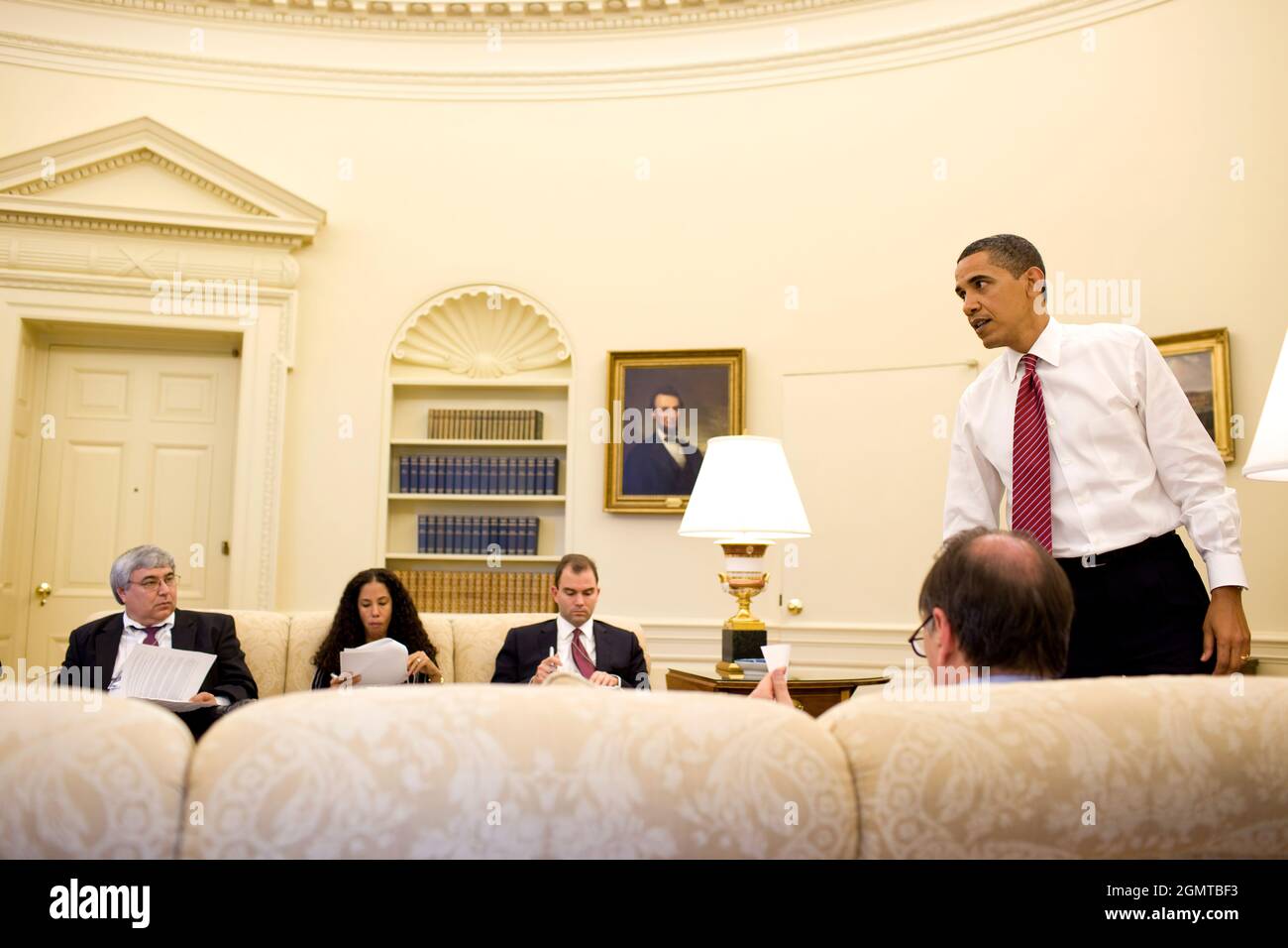 President Barack Obama meets with senior staff in the Oval Office, May 20, 2009. (Official White House photo by Pete Souza) This official White House photograph is being made available for publication by news organizations and/or for personal use printing by the subject(s) of the photograph. The photograph may not be manipulated in any way or used in materials, advertisements, products, or promotions that in any way suggest approval or endorsement of the President, the First Family, or the White House. Stock Photo