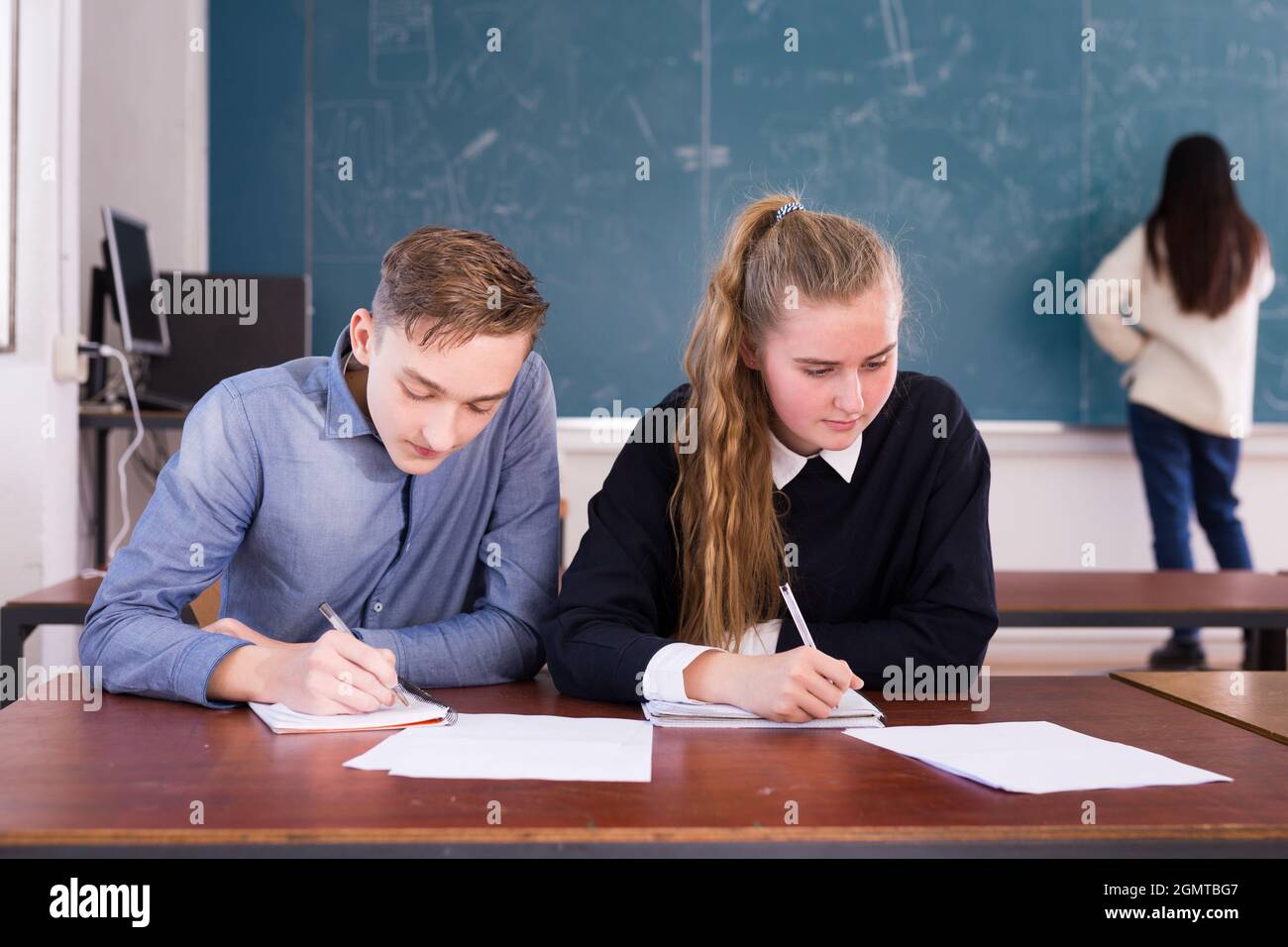 Two students studying in classroom Stock Photo - Alamy