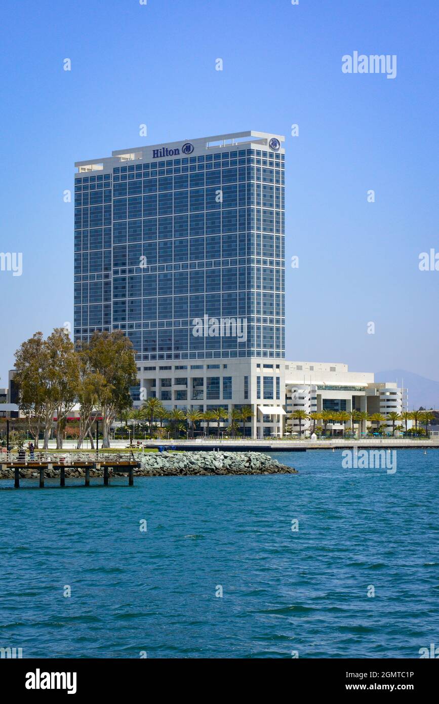 A view across the San Diego Bay of the South Embarcadero Park and the Hilton San Diego Bayfront Hotel across from the Coronado Bridge in San Diego, CA Stock Photo