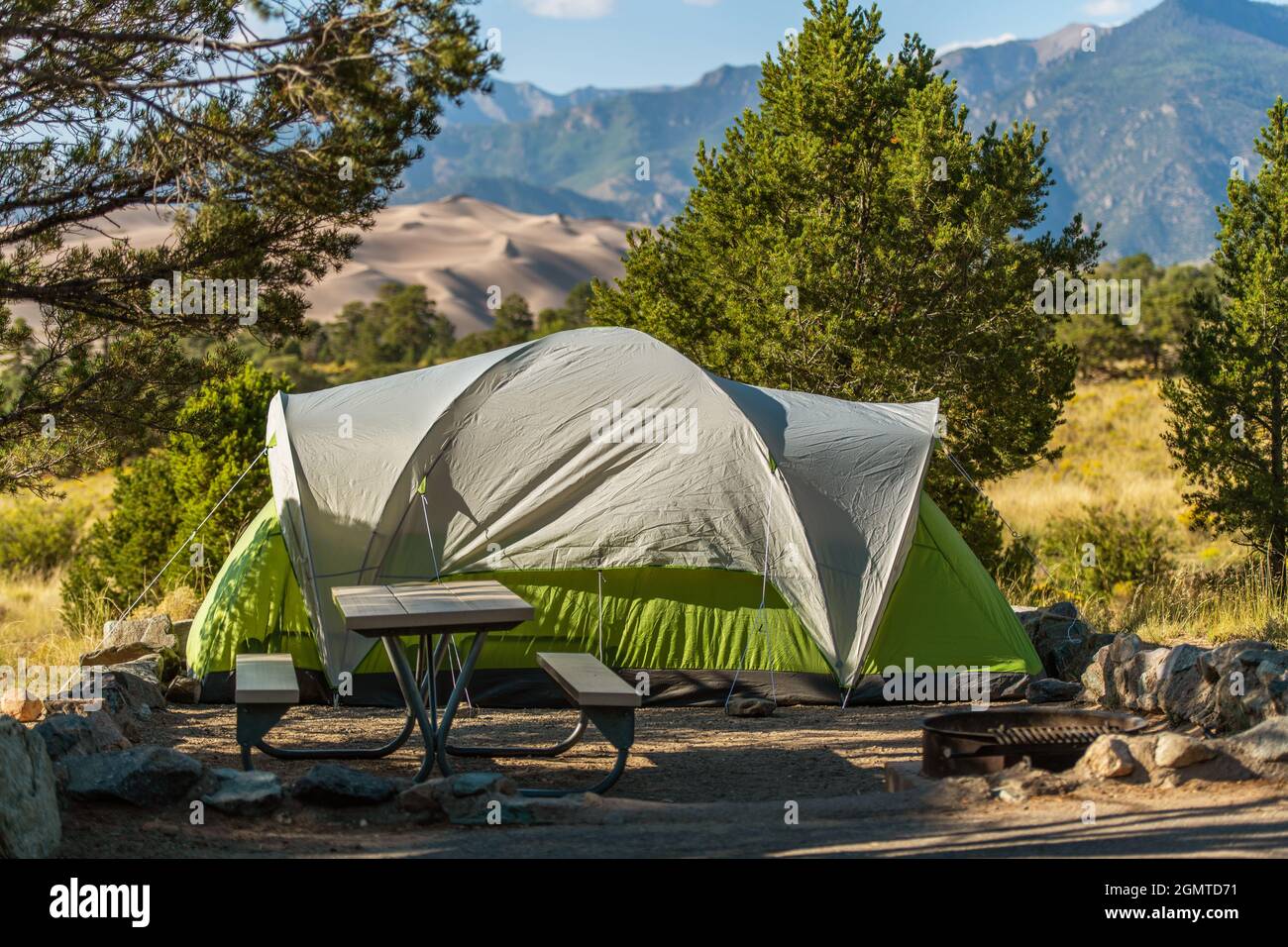 Scenic View Campground Pitch with Large Green Tent. Camping in Great Sand Dunes National Park Colorado, United States of America. Stock Photo