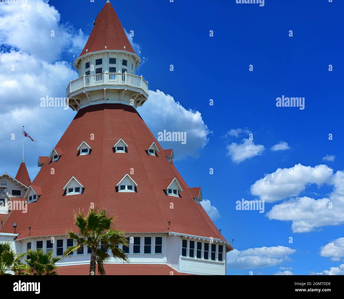 Close up of the unique red turret of the iconic 1888 Queen Anne Victorian style Hotel del Coronado in San Diego, CA against blue sky Stock Photo
