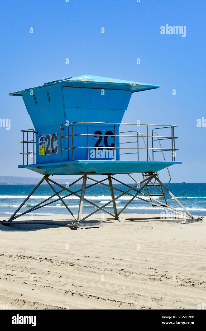 The iconic Southern California lifeguard tower stand in blue on white sandy Coronado Beach, San Diego, CA, USA Stock Photo